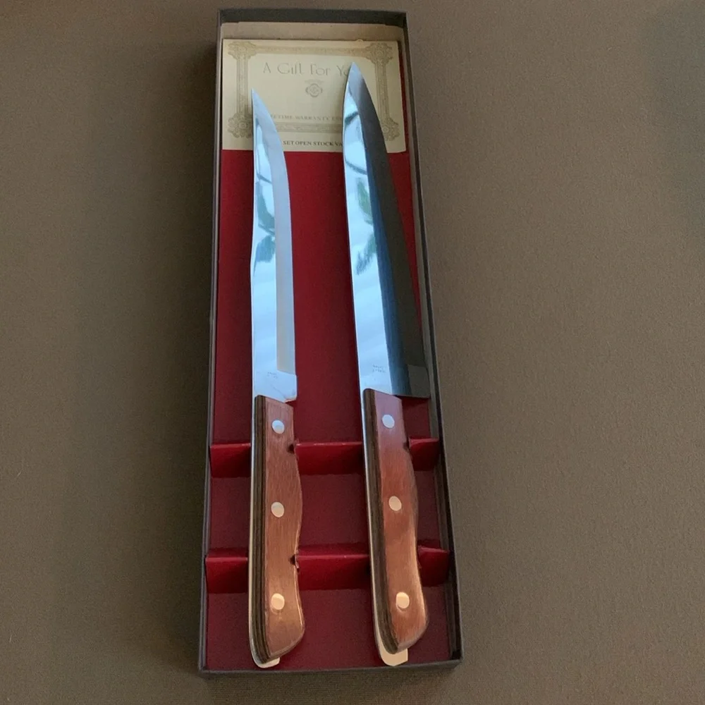 Set of Maxam carving knives in original box, blades approximately 6” & 8”